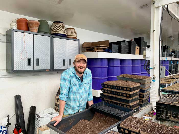 Ryan Merck's purple passive solar water barrels. Say that three times fast! Best color water barrels for greenhouse