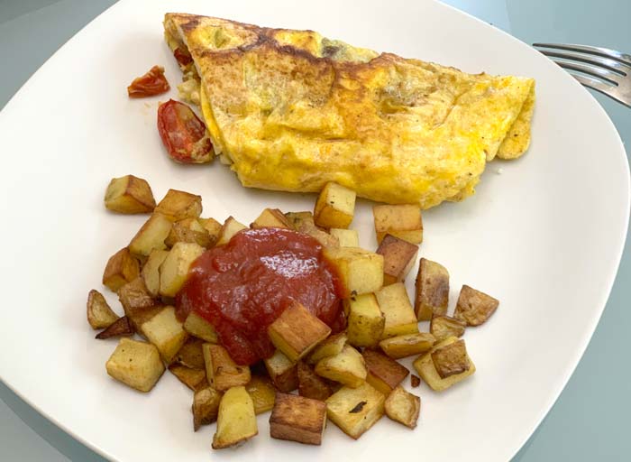 A quick popular meal at our house: pan-roasted potatoes with lacto-fermented ketchup plus duck egg omelette (with roasted tomatoes inside, of course).